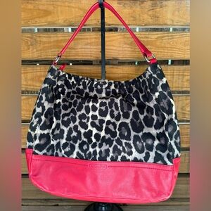 Authentic COACH purse -Parker Ocelot Print Fabric with red leather accents.